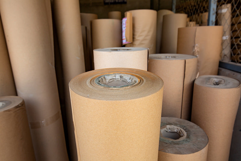 rolls of kraft paper used as raw material to manufacture kraft boxes, kraft bowls and salad bowls.