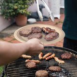 serving bbq burger patties and sausage on natural bagasse plate