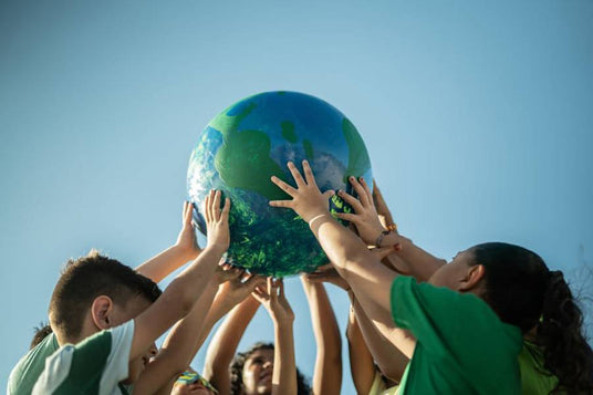 children holding a globe high celebrating environment protection